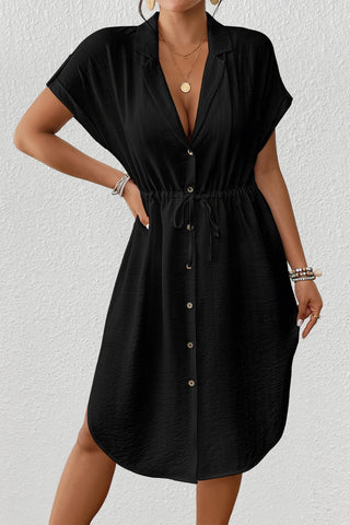 A woman wearing a Black-Short-Sleeve-Shirt-Dress.