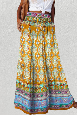 A woman wearing a Boho floral maxi skirt.