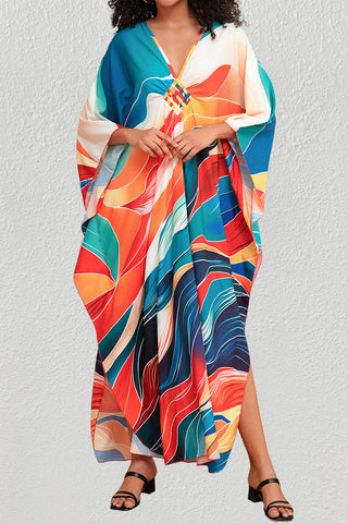 A woman wearing a cloud print plus size caftan.