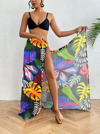A woman wearing a Boho Sarong Coverup Colorful Floral with bikini.
