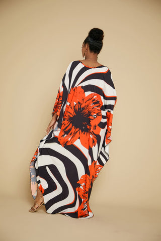 A women wearing a V-neck  flower 
 kaftan dress.