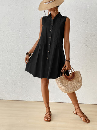 Sleeveless black swimsuit cover-up dress.