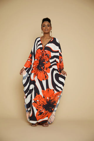 A women wearing a flower V-neck kaftan dress.