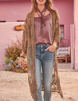 A woman wearing a brown lace summer kimono cardigan outfit.